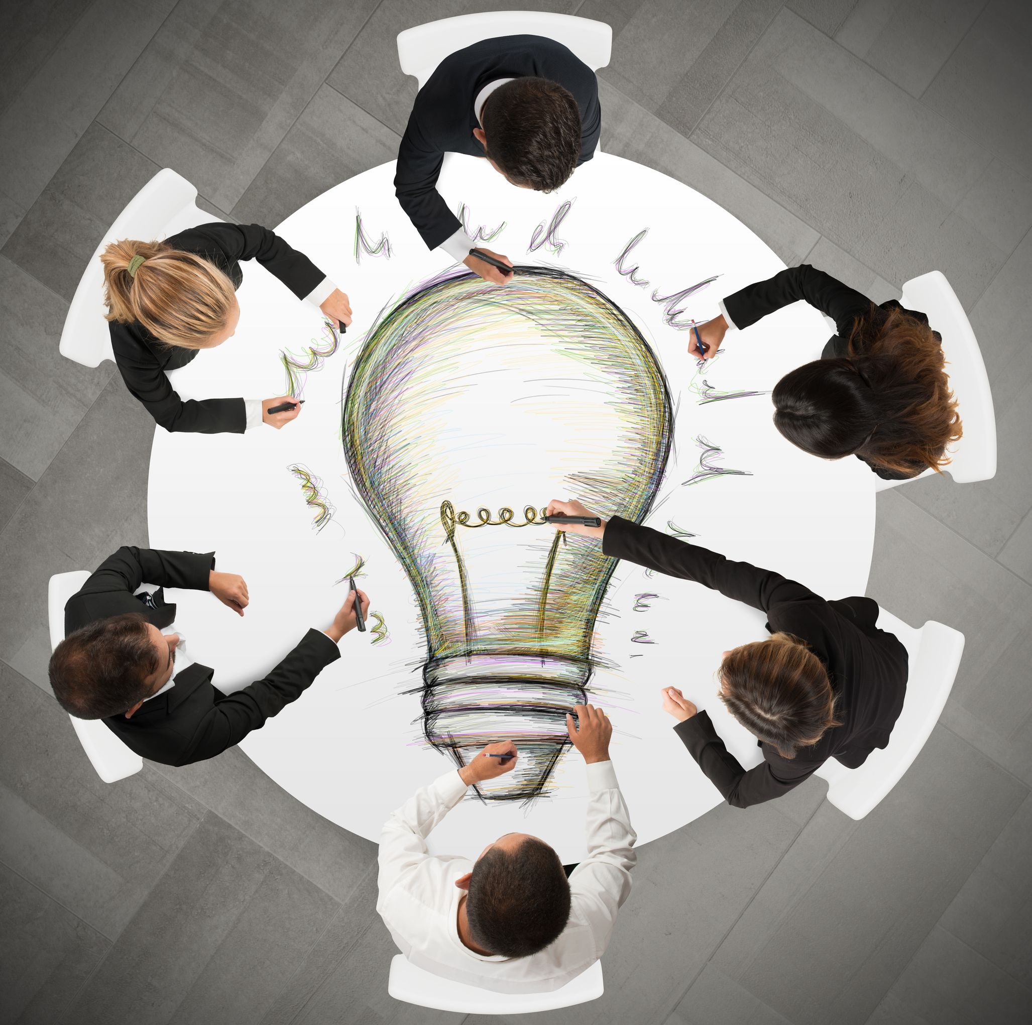 Teamwork draws a big idea during a meeting